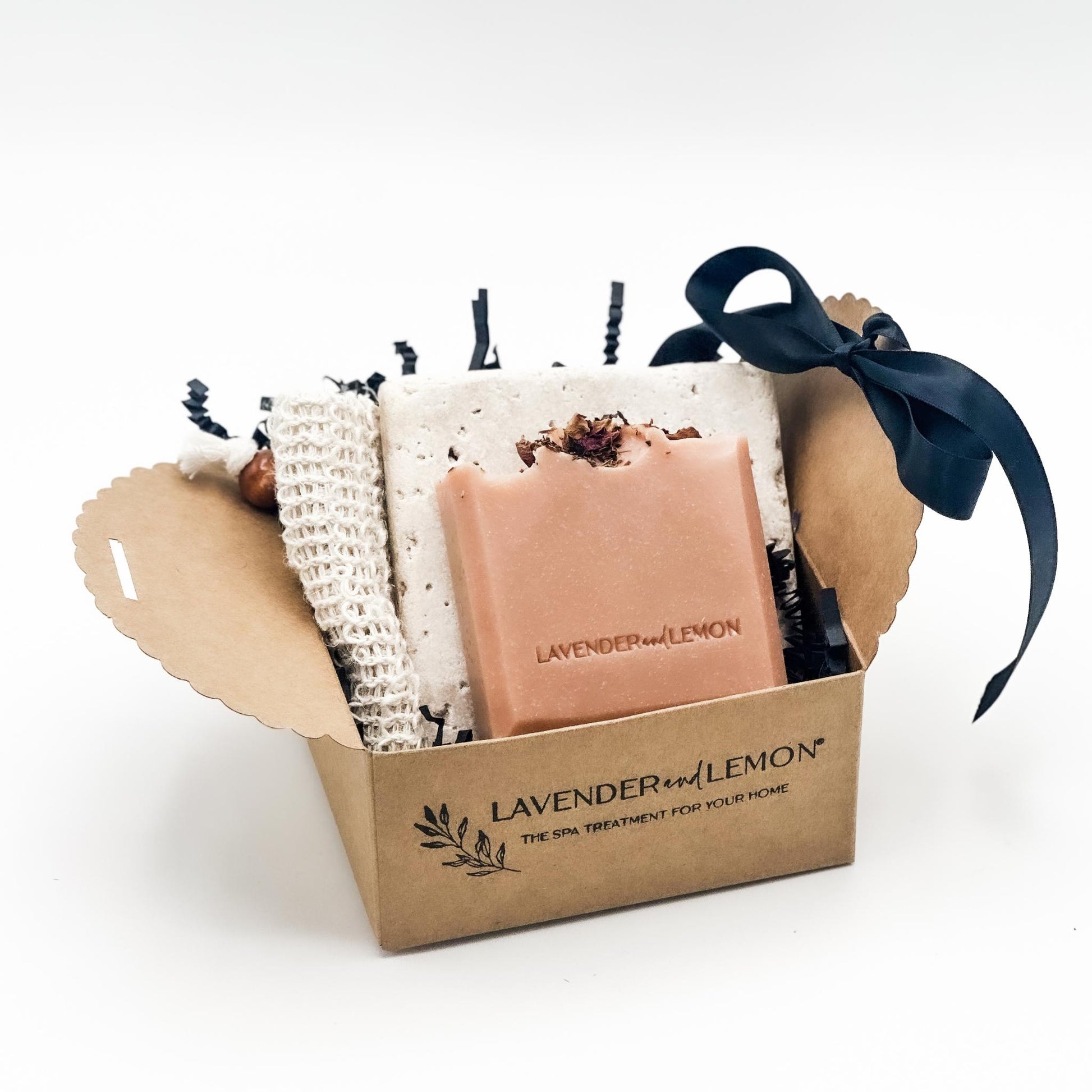 Gift set with soap, soap stone and a soap saver bag in a box labelled 'Lavender & Lemon' on a white background