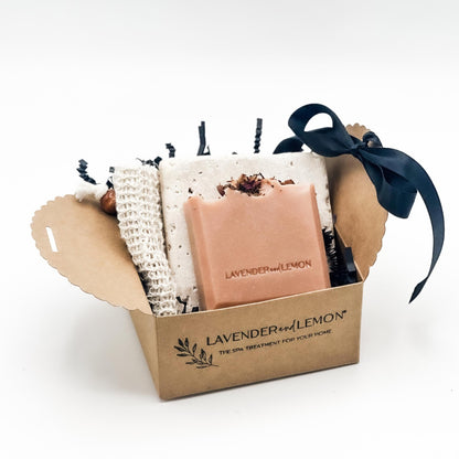 Gift set with soap, soap stone and a soap saver bag in a box labelled 'Lavender & Lemon' on a white background